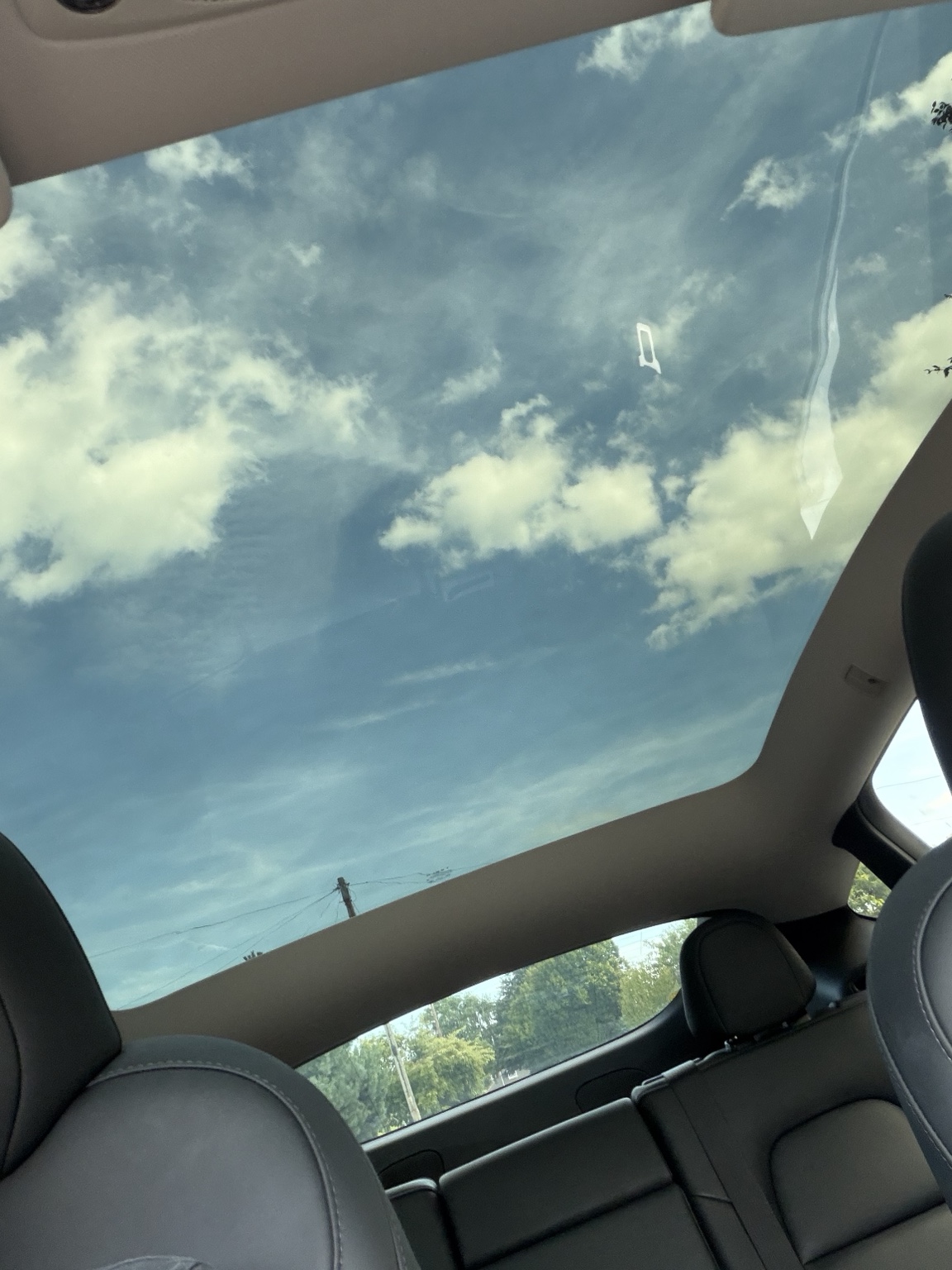 Full glass panoramic roof inside the Cooks Cars Thanet 2024 Tesla Model Y